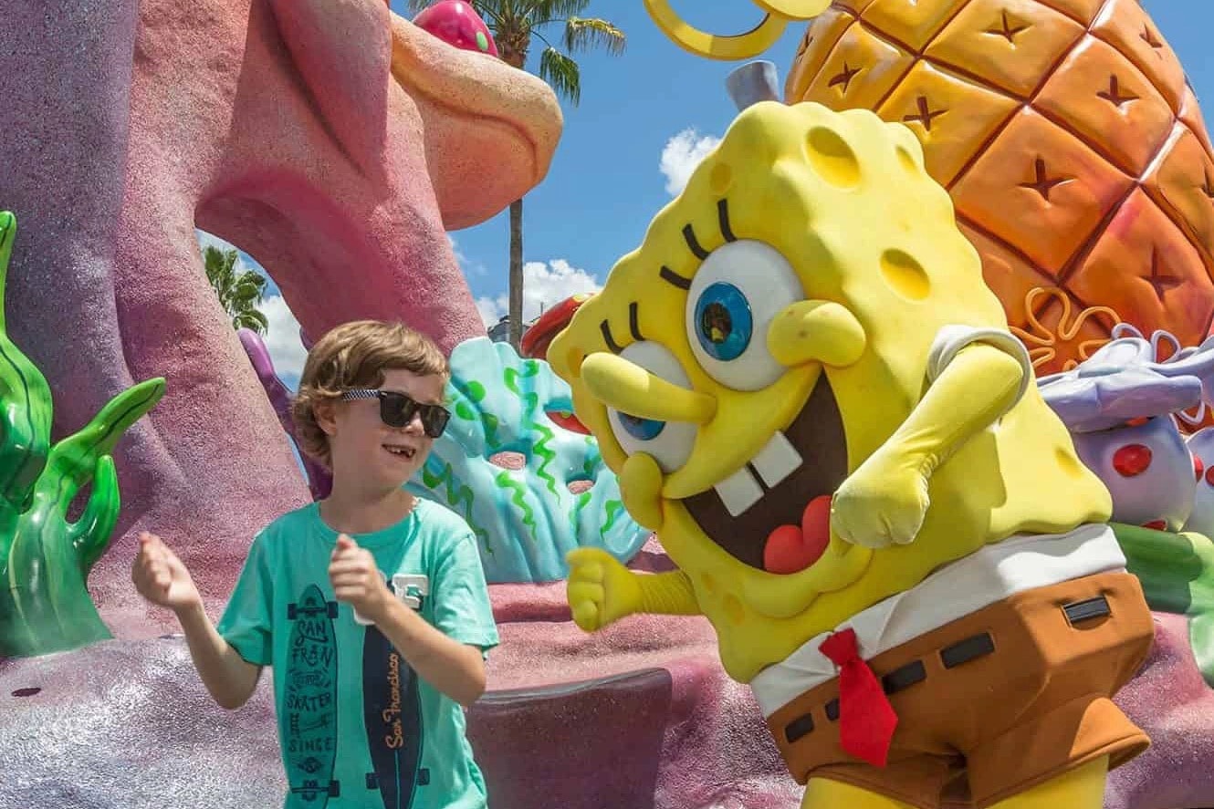 Excited child meeting SpongeBob SquarePants character at Universal Orlando — Magic VIP Tours special needs family experience
