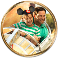 Joyful family enjoying a ride at Disney with our VIP Tour services.